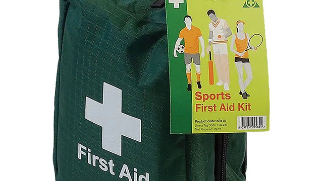 Sports first-aid kit laid out ready on the touchline before kickoff