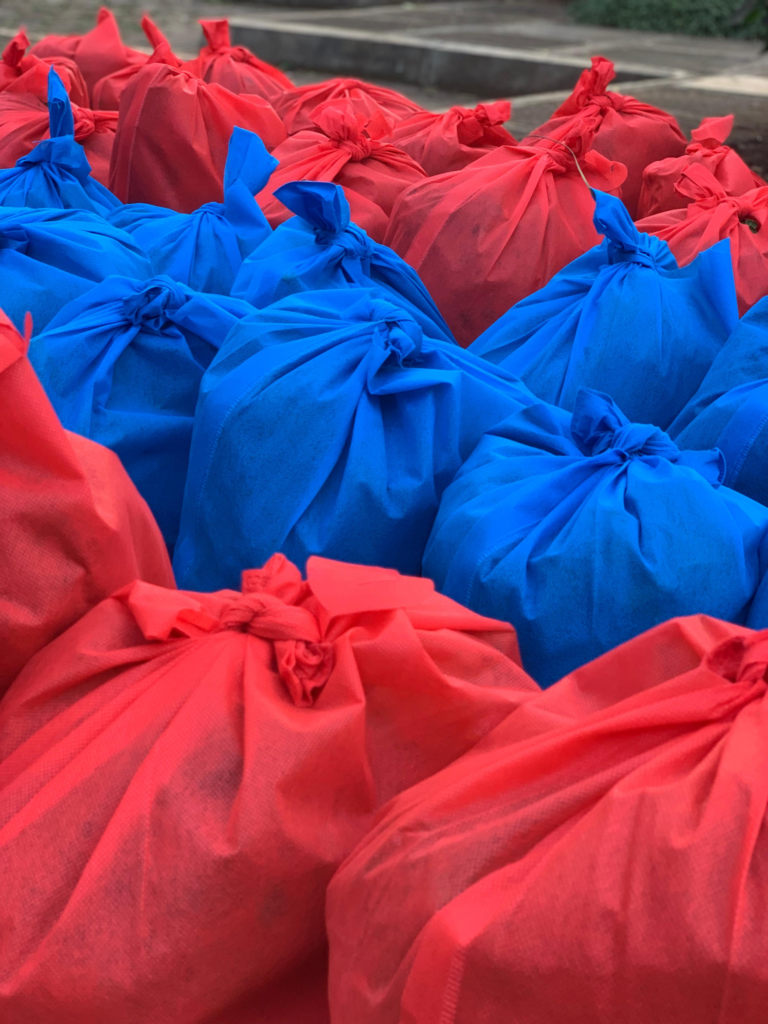 Red and blue provision parcels prepared for Kisasa FC players during the 2026 season.